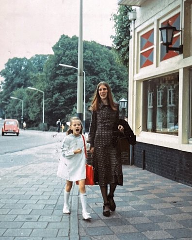 Anne walking with Dana's mum as a little girl